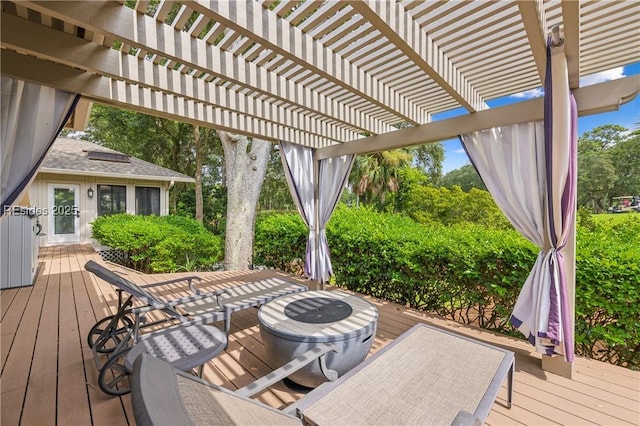 wooden deck featuring a pergola