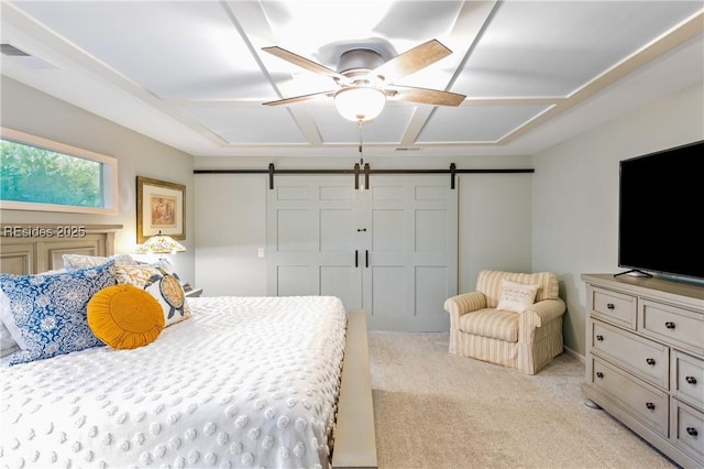 bedroom with light colored carpet, a barn door, and ceiling fan