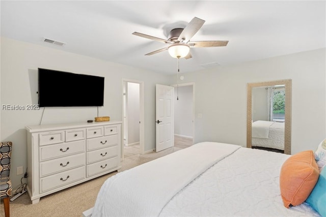 bedroom with light colored carpet and ceiling fan