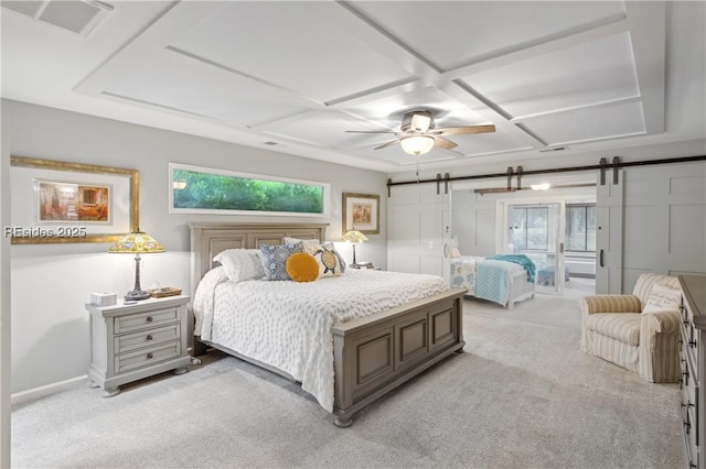 bedroom with a barn door, coffered ceiling, light carpet, and ceiling fan