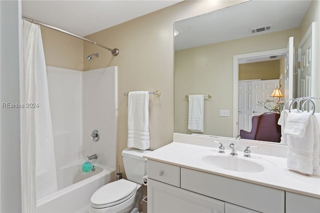 full bathroom with vanity, toilet, and shower / tub combo with curtain