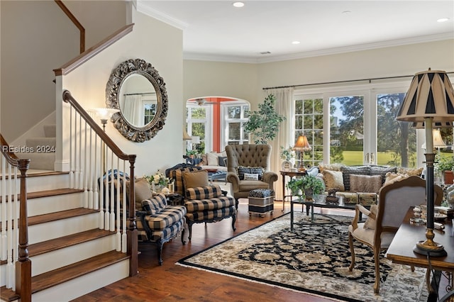 living room with crown molding and dark wood-type flooring