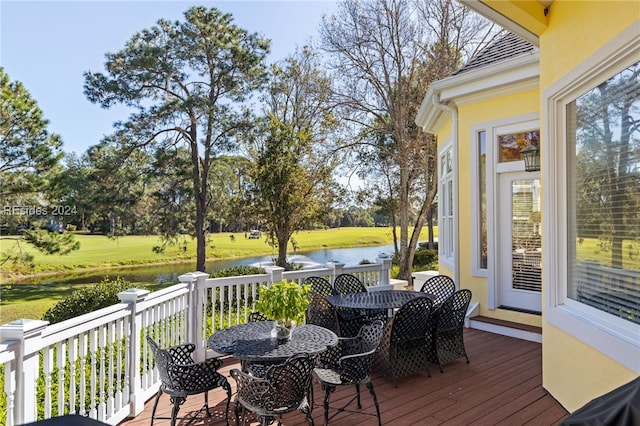 wooden deck featuring a water view