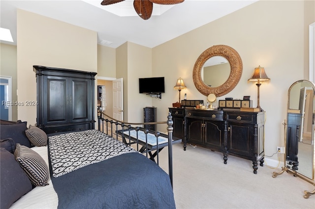 bedroom featuring light colored carpet and ceiling fan