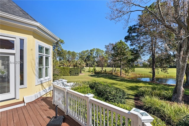 deck featuring a water view and a yard