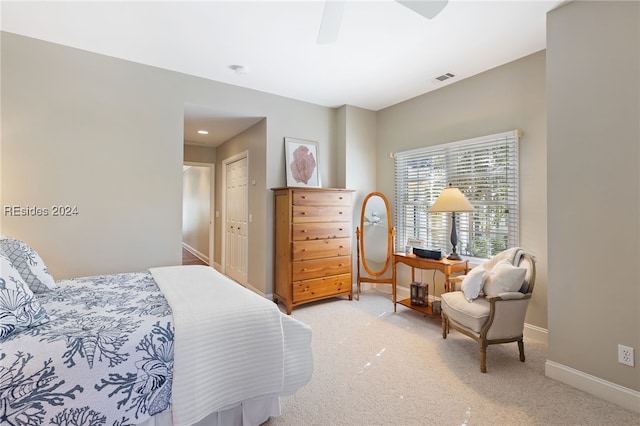 bedroom with ceiling fan, carpet flooring, and a closet