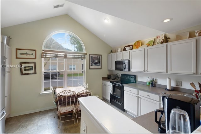 kitchen with white cabinetry, lofted ceiling, and black appliances