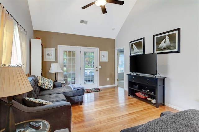 living room featuring ceiling fan, wood-type flooring, and high vaulted ceiling