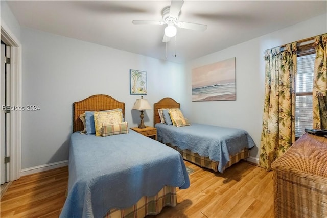 bedroom with hardwood / wood-style flooring and ceiling fan