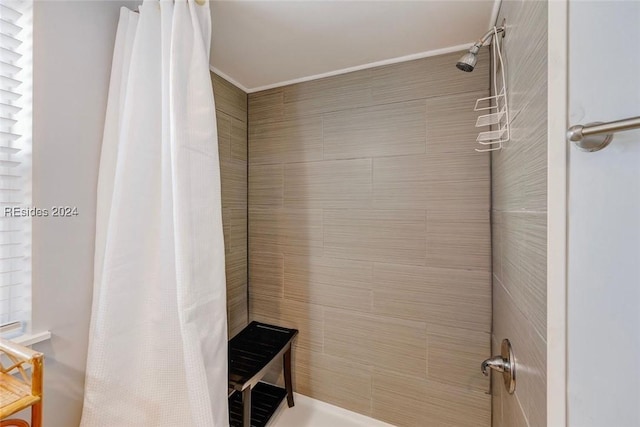 bathroom with a shower with curtain