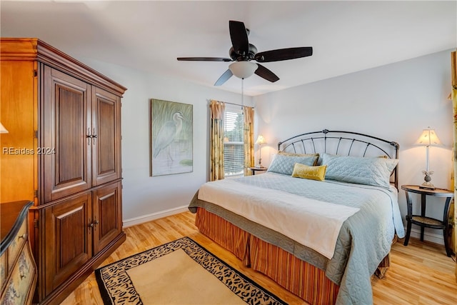 bedroom featuring ceiling fan and light hardwood / wood-style flooring