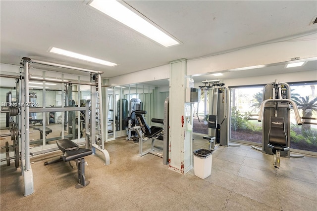 exercise room featuring a textured ceiling