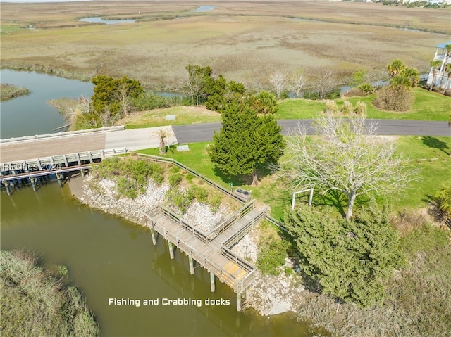 drone / aerial view featuring a water view and a rural view