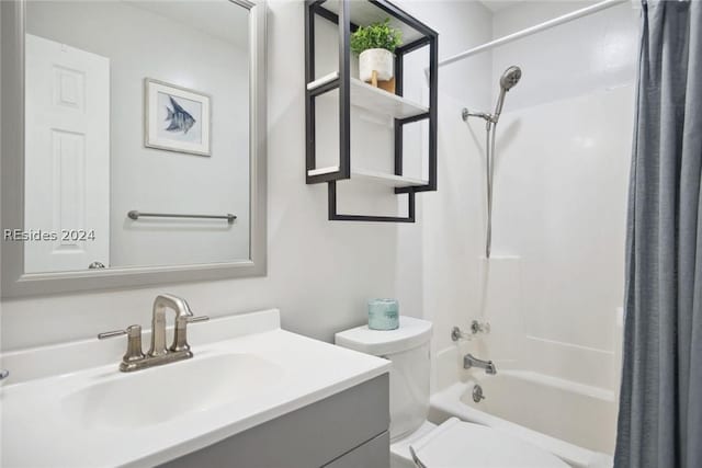 full bathroom with vanity, toilet, and shower / bath combo with shower curtain