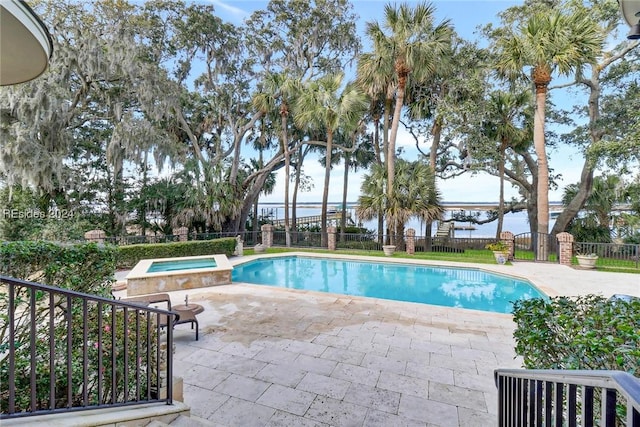 view of swimming pool with central AC, a patio, and an in ground hot tub