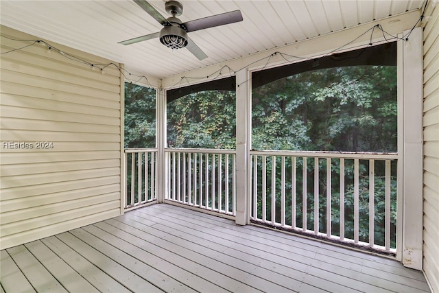 wooden deck featuring ceiling fan