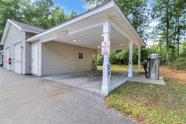 view of car parking with a garage