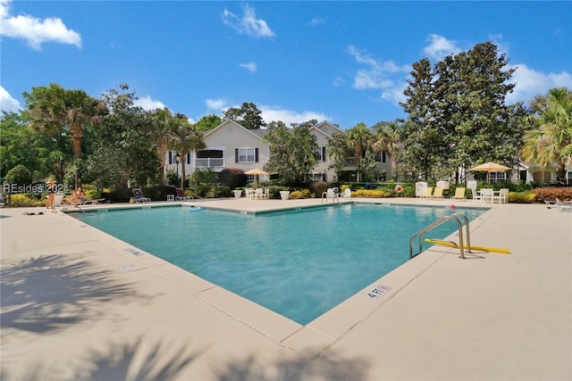 view of pool featuring a patio area