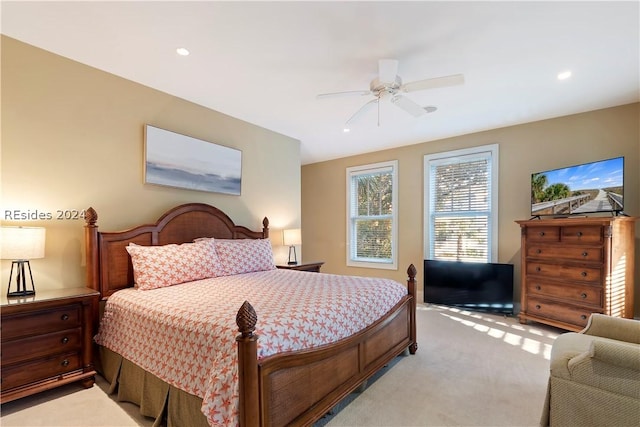 bedroom with light colored carpet and ceiling fan