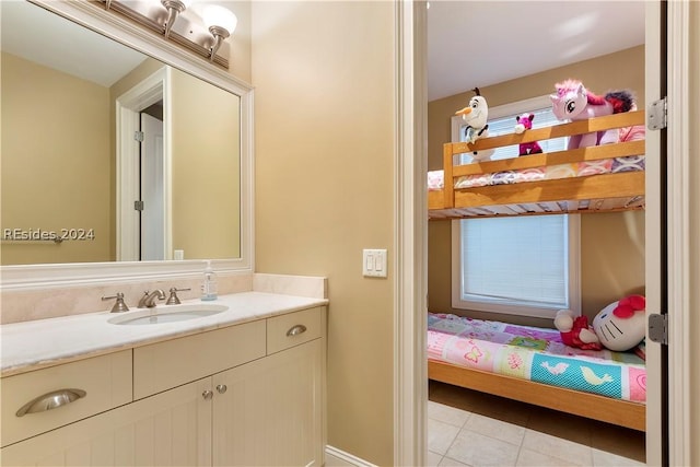 bathroom featuring vanity, a wealth of natural light, and tile patterned floors