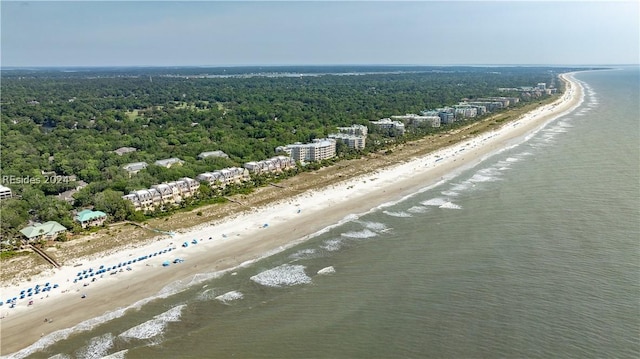 drone / aerial view featuring a water view and a beach view