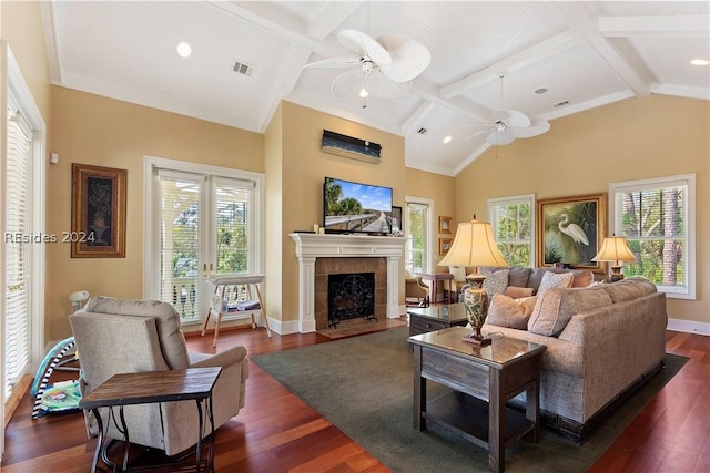 living room with a healthy amount of sunlight, vaulted ceiling with beams, and dark hardwood / wood-style floors