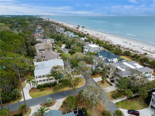 birds eye view of property featuring a view of the beach and a water view