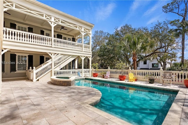 view of pool with an in ground hot tub, ceiling fan, and a patio area