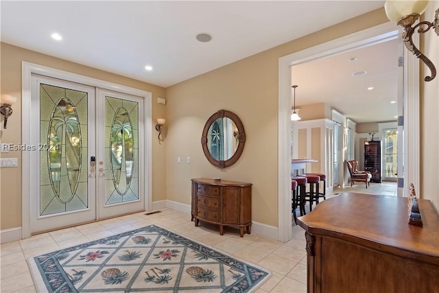 tiled foyer featuring french doors