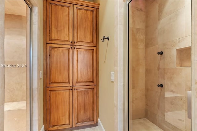 bathroom featuring an enclosed shower