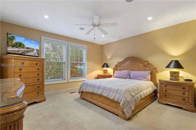 carpeted bedroom featuring ceiling fan