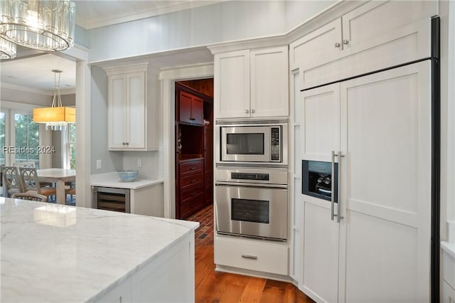 kitchen with white cabinetry and built in appliances