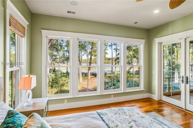 entryway featuring light hardwood / wood-style flooring and french doors