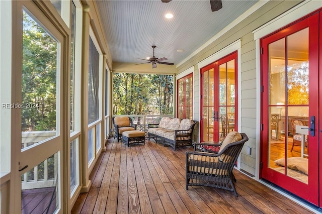 sunroom / solarium featuring ceiling fan