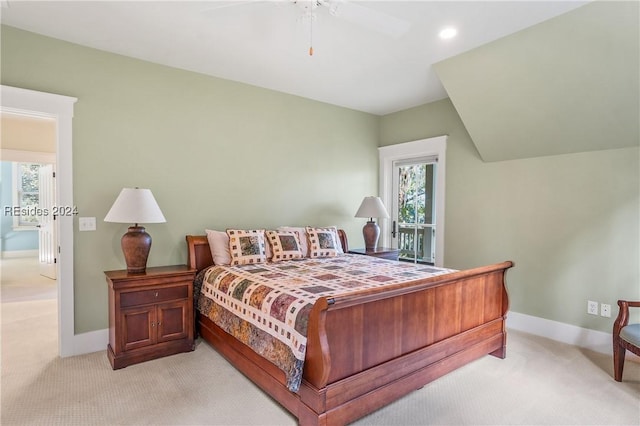 bedroom with ceiling fan and light colored carpet