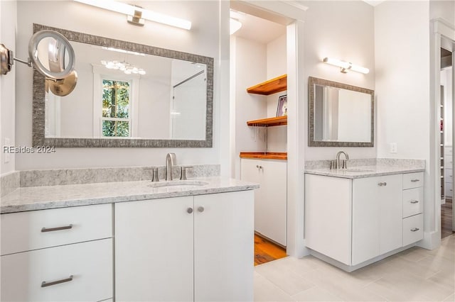 bathroom featuring tile patterned floors and vanity