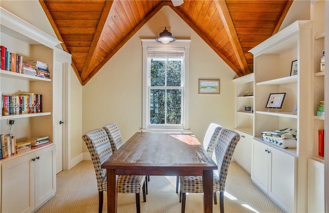 carpeted dining area featuring wood ceiling, lofted ceiling, and a healthy amount of sunlight