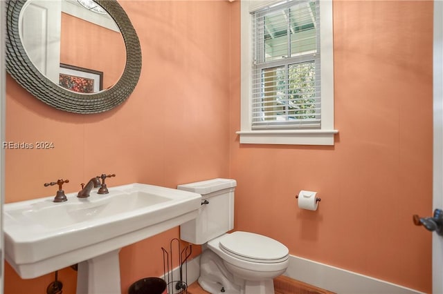 bathroom with sink and toilet