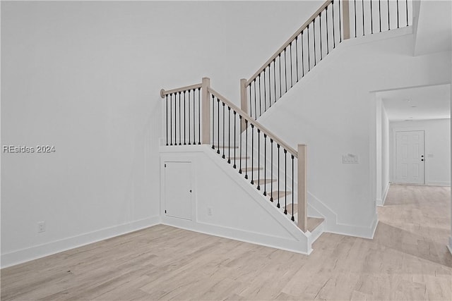 stairway featuring hardwood / wood-style floors