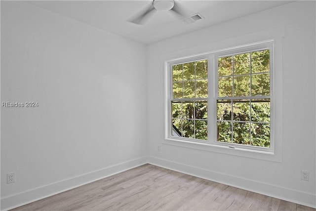 unfurnished room with ceiling fan and light hardwood / wood-style flooring