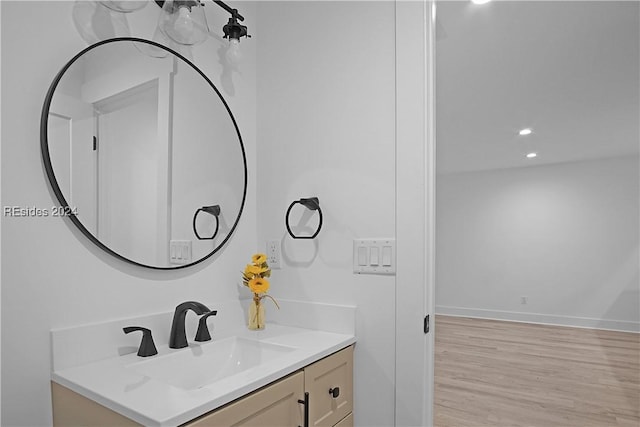 bathroom featuring vanity and wood-type flooring