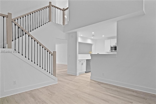 unfurnished living room featuring light wood-type flooring