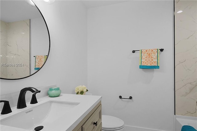 bathroom with vanity and toilet