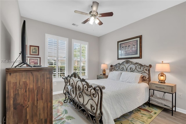 bedroom featuring ceiling fan and light wood-type flooring