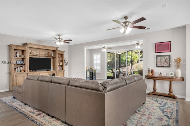 living room with light hardwood / wood-style flooring