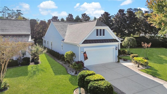 view of front of property with a garage and a front yard