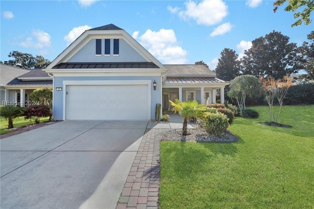 view of front of house with a garage and a front lawn