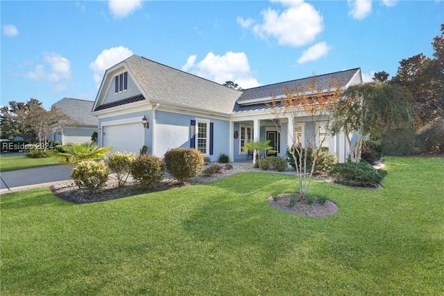 view of front of house with a garage and a front lawn