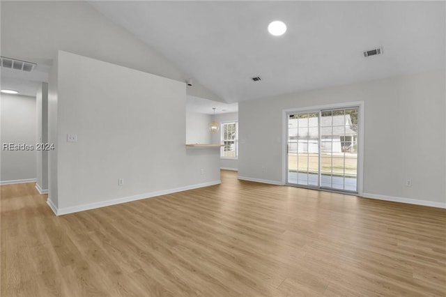 unfurnished living room with light hardwood / wood-style flooring and high vaulted ceiling