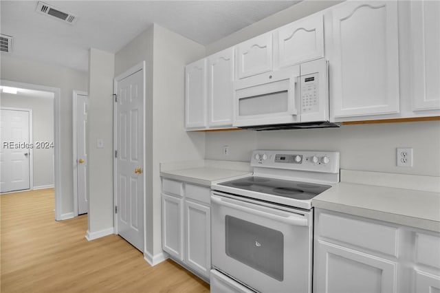 kitchen featuring white cabinetry, white appliances, and light hardwood / wood-style floors